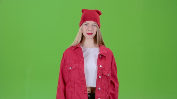 Teen Advertises the Goods and Shows a Finger Down on Green Screen