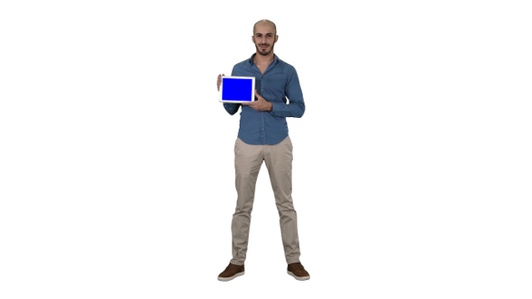 Smiling casual man presenting a tablet with a blank screen