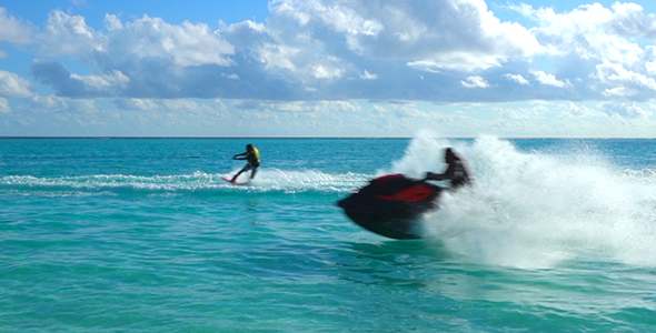 Water Ski and Jet Ski Racing Past Camera