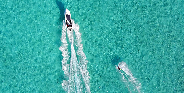 Man Falling off WakeBoard into Tropical Ocean