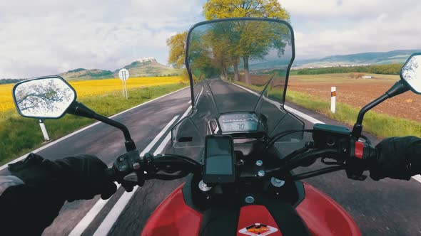 Motorcyclist Riding on the Road Near Spiss Castle. Spissky Hrad. Slovakia