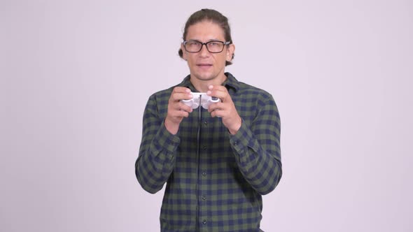 Happy Hipster Man Playing Games and Winning