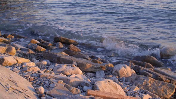 Sea Waves and Rocks on Coast at Scenic Sunset