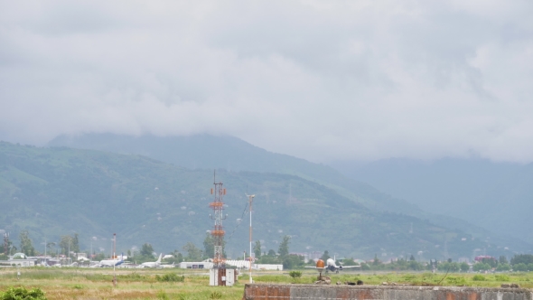 Airplane Takes Off From the Airport in Mountains - Georgia alt