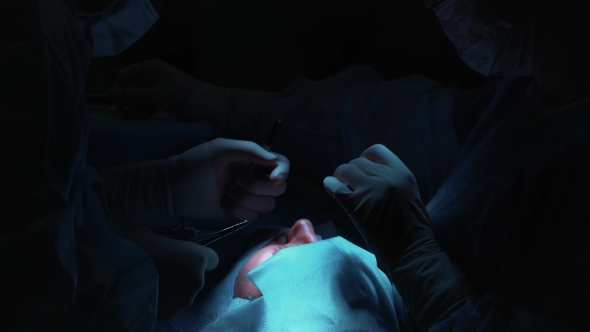 The Surgeon Is Performing an Operation on the Eyes, . Correction of Eyes and Eyes