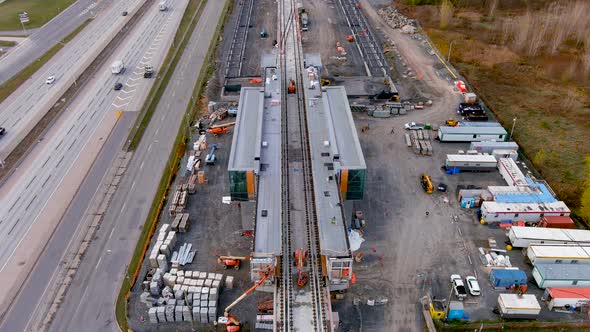 4K camera drone view of the construction site of the new Fairview Station of the REM in Montreal.