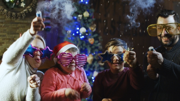 Happy Young Family Celebrating Christmas