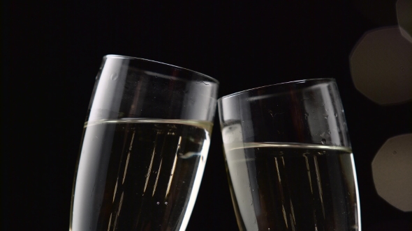 Two Glasses with Sparkling Champagne Toasting Over Holiday