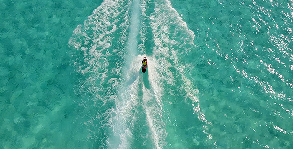 Wake Boarder Being Pulled in Beautiful Clear Tropical Water