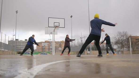 Sport Group of Young Multi Ethnic People Practicing Tai Chi or Qigong