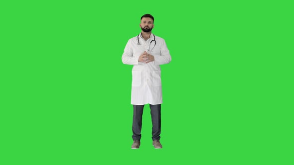 Confident Turk Doctor Standing and Looking To Camera on a Green Screen, Chroma Key.