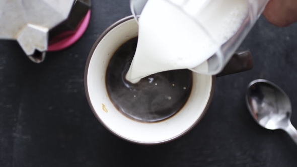 Milk Being Poured Into Coffee