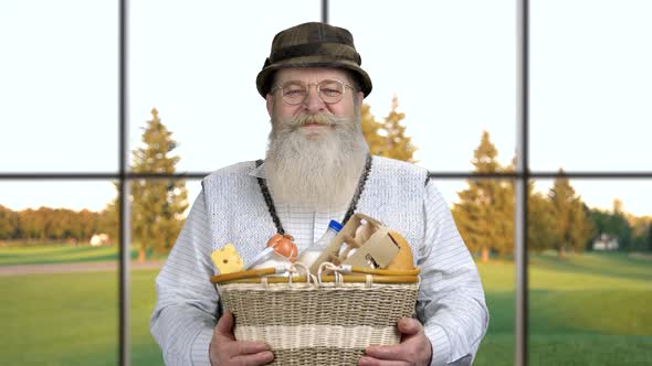 Portrait of Friendly Farmer Presenting Healthy Food.