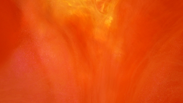 Red Ink Reacting in Water Creating Abstract Background. alt