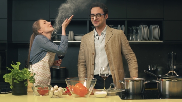 Happy Young Couple in the Kitchen