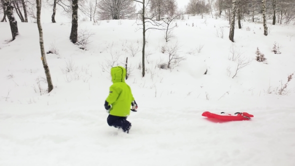 Winter Side Follow Little Child Pulling Red Bobsled