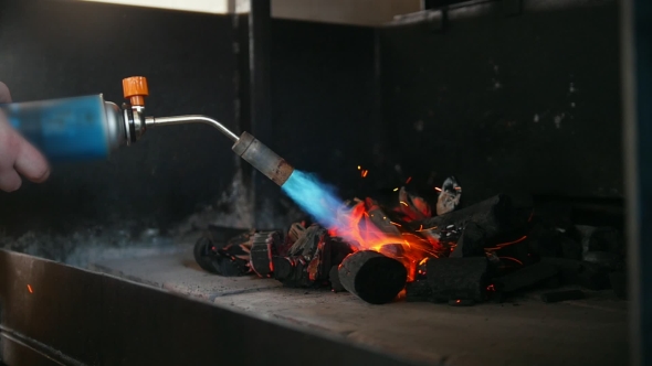 Kindling of Charcoal in the Barbecue Oven Using a Gas Burner