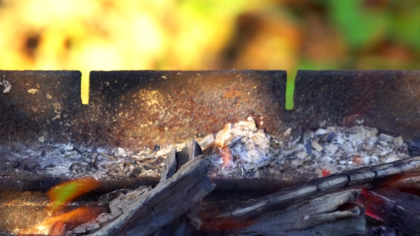 Charcoal Burning under a Barbecue Grill