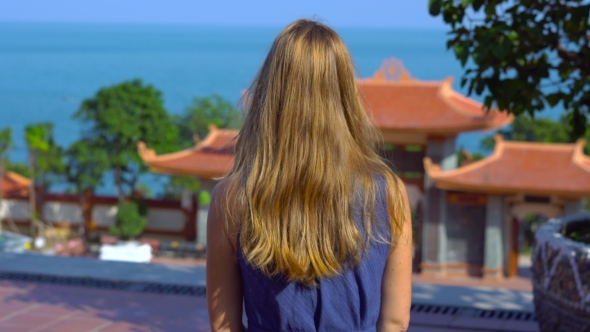 Young Woman Watching a Panoramic View of a Budhist Temple on Phu Quoc Island