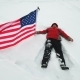 Man Is Waving US Flag Lies in the Snow - VideoHive Item for Sale