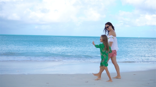 Beautiful Mother and Daughter on Caribbean Beach