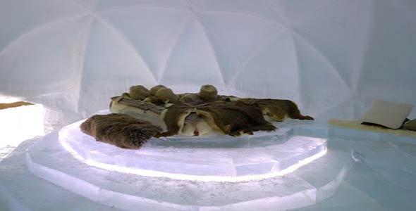 Bedroom Inside an Ice Hotel Covered in Animal Hide Blankets