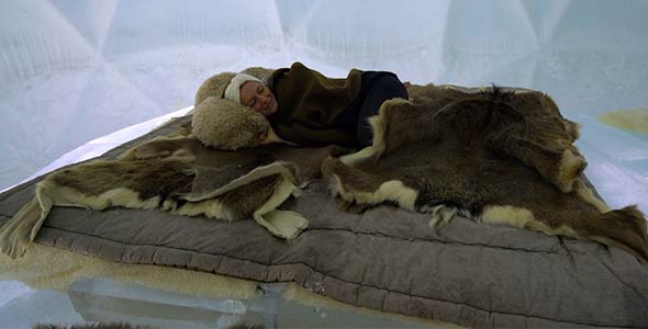 Girl Sleeping in an Incredible Ice Bed inside an Igloo