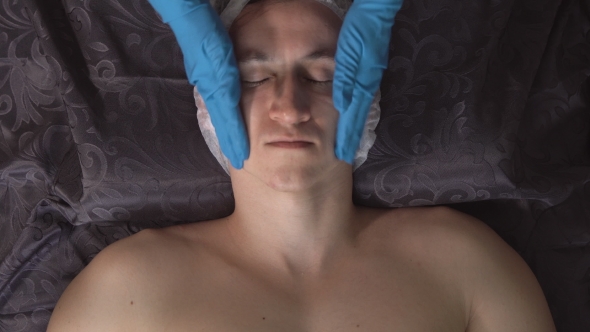 Young Man in the Spa on Facial Massage Procedure