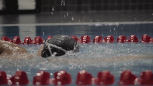 Sports Woman Swimming Crawl Stroke in Blue Waterfloating Pool