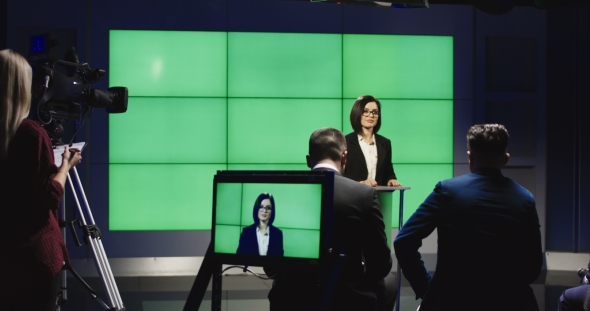 Confident Businesswoman Holding Speech on Stage