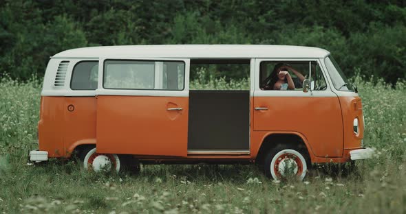 Very Pretty Lady Dacing Nicely in a Retro Bus