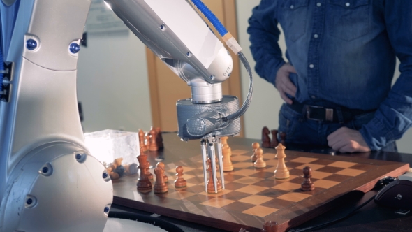 Robot Chessplayer Playing Chess with a Man