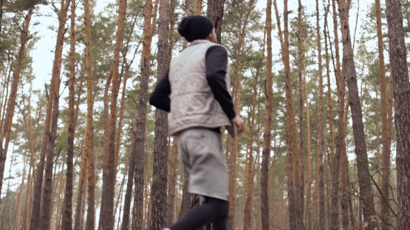 Young Guy Has a Pain in His Loin During Running in the Forest