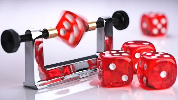 Rotation of the Red Dice on a Special Device Balancer To Check the Correct Shape,so That the Game alt