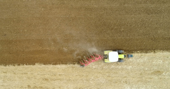 Tractor Plowing Field - Aerial View