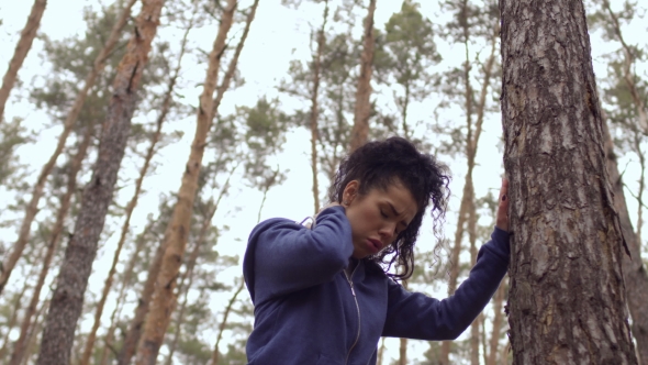 Young Woman Catch Cold the Muscle in Neck During Morning Exercises in the Forest