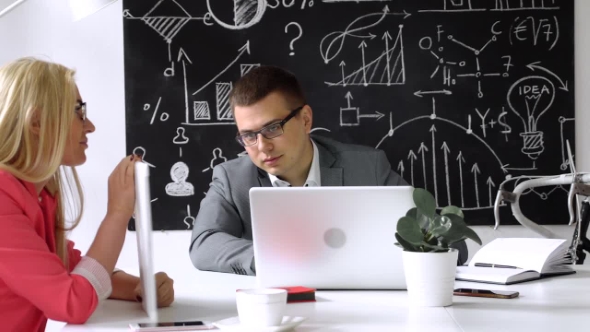 Teamwork: Business Discussion at the Office Table