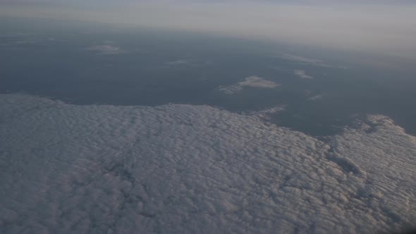 White Cumulus Clouds in the Porthole