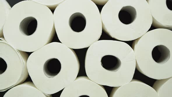 Rolls of Toilet Paper Placed on Black Background