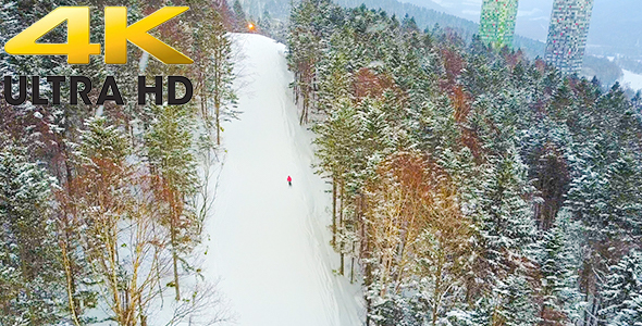 Aerial Shot of Woman Skiing at Ski Resort