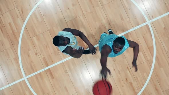 Slow Motion of Africanamerican Basketball Players Training in the Gym