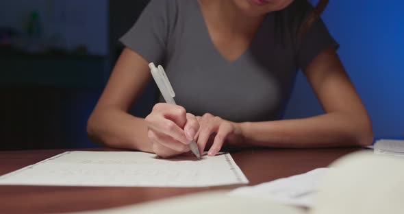 Woman Study on The Note at Home in The Evening