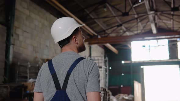 Professional Worker Walking Through Logistics Center Warehouse Factory