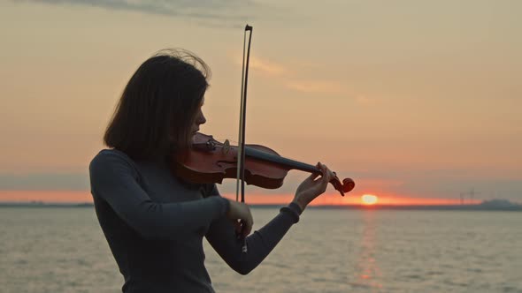 Violinist Is Playing Inspired By Sunrise