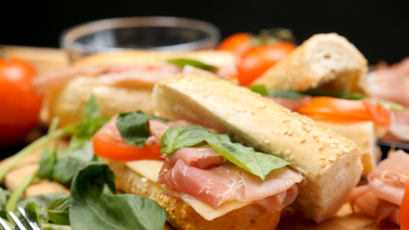 Healthy Delicous Sandwich Made of Prosciutto, Cheese and Tomatoes at the Kitchen