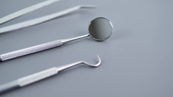 Set of Dentist Tools on Gray Background