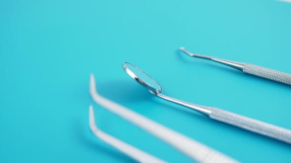 Set of Dentist Tools on Green Background