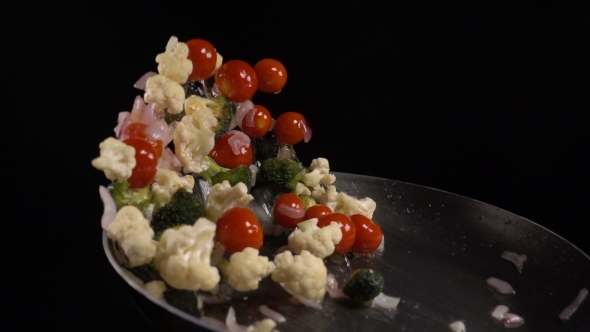 Stirring Vegetables in a Frying Pan