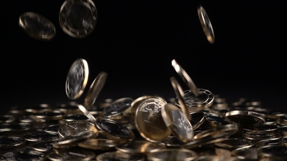 One Euro Coins Fall on a Black Background