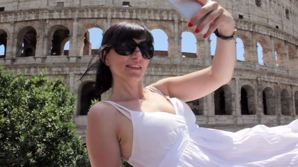 Young Tourist Makes Selfie on Ancient City with Mobile